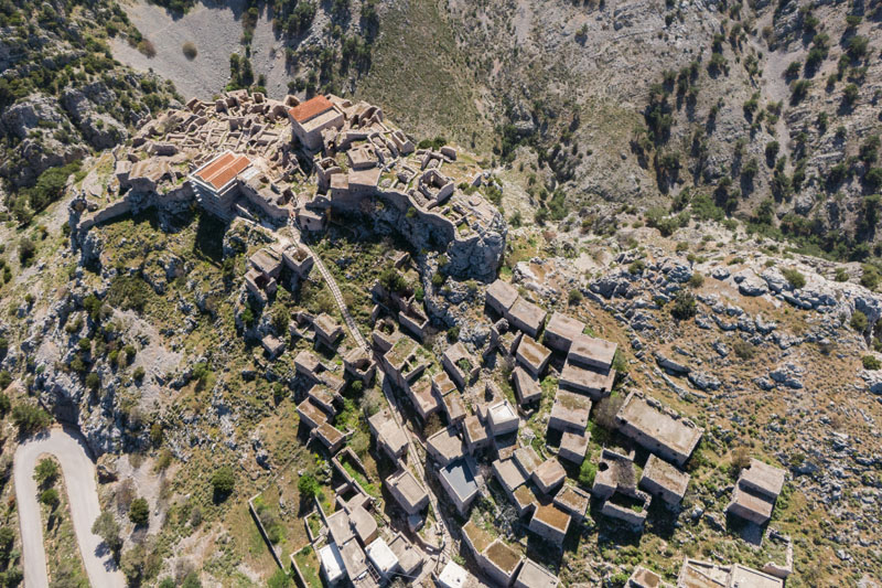 Anavatos, ruined mountain medieval village in the island of Chios, Greece. bird eye view by drone